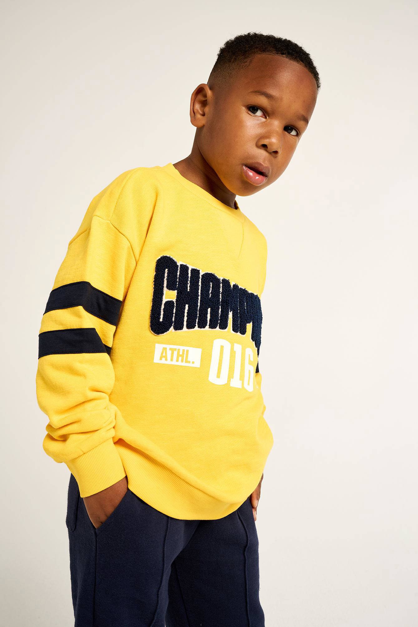 Champion sweater clearance geel que es