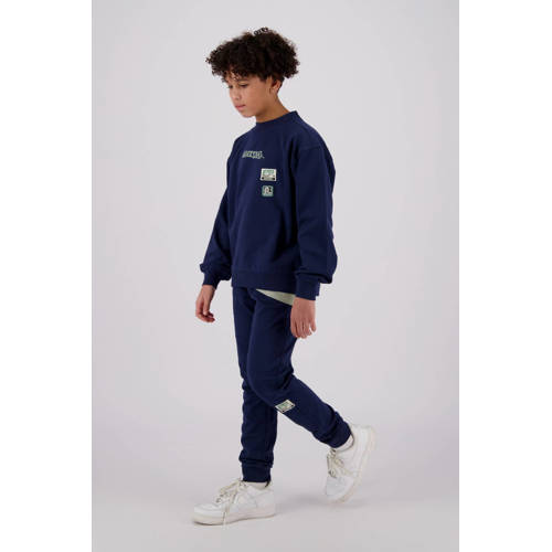 Raizzed tapered fit joggingbroek Tezu met logo donkerblauw Jongens Sweat 128